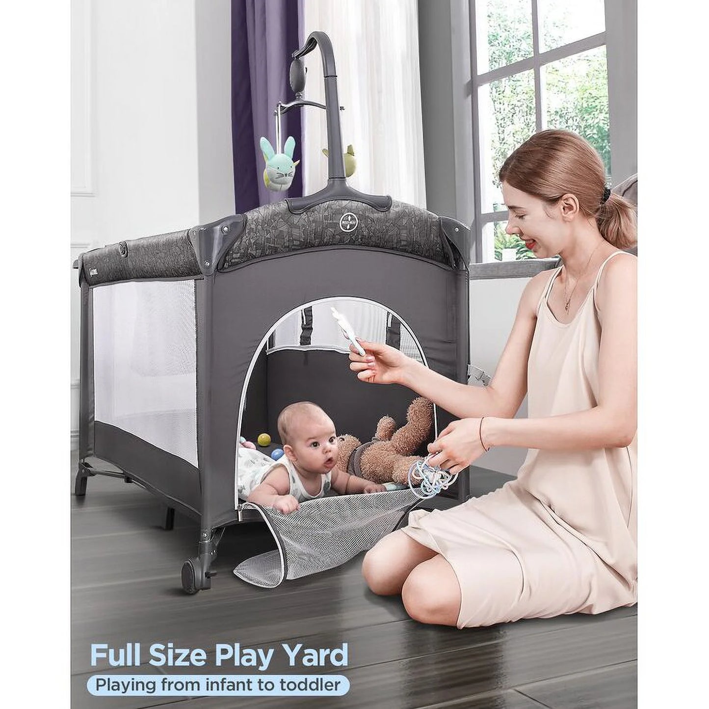 Babybond 3-in-1 Bedside Bassinet, Play Yard & Diaper Changer, suitable for newborns to toddlers aged 0-2. Comes with mattress, mosquito net, bottom diaper storage compartment and toy bar.Grey